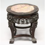A CHINESE HARDWOOD AND MARBLE INSET LOW STAND, with pierced and carved frieze, four carved legs