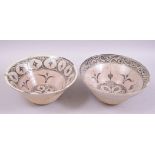 TWO ISLAMIC PARTLY GLAZED POTTERY BOWLS, each similarly painted with stylised motifs, both approx.