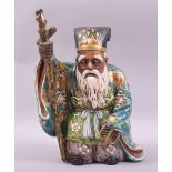 A JAPANESE KUTANI PORCELAIN FIGURE OF AN ELDERLY SAGE, standing with a staff in his right hand, 30cm