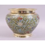A CHINESE CHAMPLEVE ENAMEL BRASS BOWL, decorated with floral design, 15cm diameter.