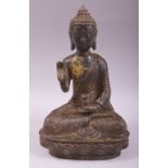 A CHINESE BRONZE MODEL OF A SEATED BUDDHA, with traces of gilt decoration, 24cm high.