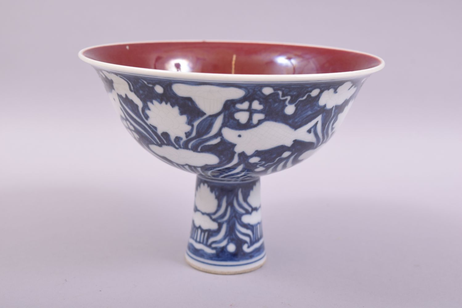 A CHINESE BLUE AND WHITE PORCELAIN STEM CUP, the exterior decorated with fish and flora, the - Image 2 of 6