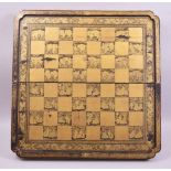 A SUPERB CHINESE GILDED AND LACQUERED FOLDING CHESS BOARD, of finest quality, 56cm wide.