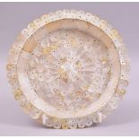 AN INDIAN GOA MOTHER OF PEARL CIRCULAR DISH, the dish entirely constructed of shaped mother of pearl