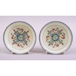 A SMALL PAIR OF CHINESE YELLOW GROUND PORCELAIN DISHES, each with six character mark to base, 10cm