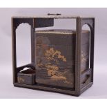 A 19TH CENTURY JAPANESE LACQUER PICNIC BOX with gilt decoration, the box containing four stacking