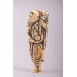 AN 18TH CENTURY CARVED IVORY SASHI NETSUKE of a sage, 10cm long.