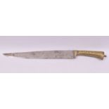 A 19TH CENTURY INDIAN KOFTGARI DAGGER WITH GOLD DAMASCENED HILT, the steel blade 32cm long, the