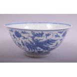 A CHINESE BLUE AND WHITE PORCELAIN PHOENIX BOWL, the exterior painted with phoenix amongst lotus and