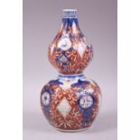 A SMALL IMARI STYLE SAMSON GOURD SHAPE PORCELAIN VASE, painted with motifs in the imari palette with