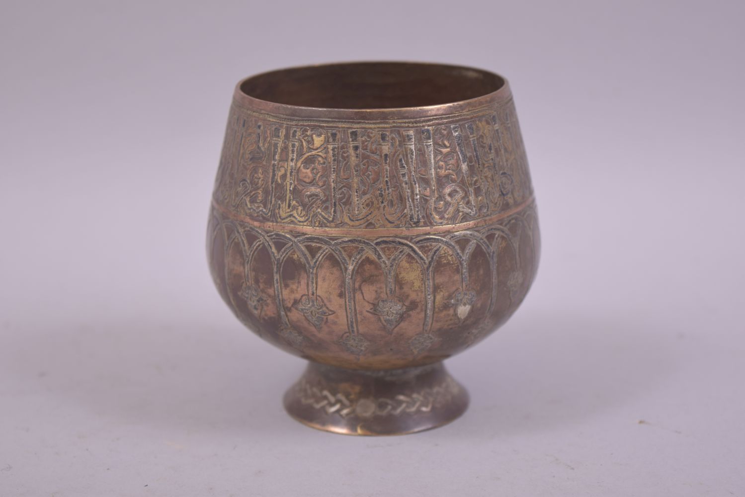 A FINE ISLAMIC SMALL BRASS SILVER AND COPPER OVERLAID GOBLET, 8.5cm high. - Image 4 of 6