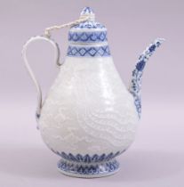 A CHINESE BLUE AND WHITE PORCELAIN WINE EWER, carved with a dragon and phoenix, with six character