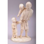 A GOOD JAPANESE MEIJI CARVED IVORY OKIMONO of a man and his children, the figure with a boy on his