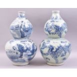 A PAIR OF CHINESE BLUE AND WHITE DOUBLE GOURD PORCELAIN VASES, one decorated with figures in a