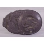 A GOOOD CHINESE CARVED INKSTONE, decorated with dragon and phoenix, 16cm long.