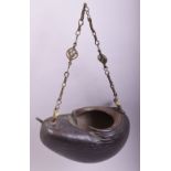 A SUPERB LARGE 19TH CENTURY COCO DE MER KASHKOOL, fitted with metal chain, 28cm long.