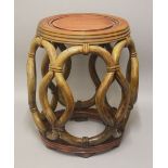 A CHINESE CARVED HARDWOOD BARREL TABLE / SEAT - with carved rope style openwork - 45cm