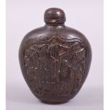 A CHINESE CARVED SNUFF BOTTLE AND STOPPER, with a panel to each side depicting deer, bats and a