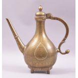 A GOOD HEAVY BRASS MUGHAL EWER, with engraved decoration, 30cm high.