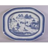 A CHINESE BLUE AND WHITE PORCELAIN CARVING DISH, decorated with landscape scene, the centre with