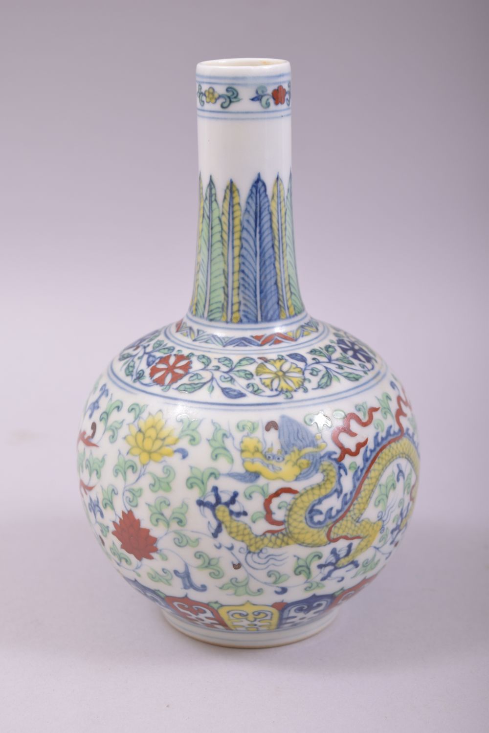 A SMALL CHINESE DOUCAI PORCELAIN BOTTLE VASE, painted in the doucai palette with a dragon and - Image 3 of 7