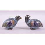 A GOOD PAIR OF CHINESE CLOISONNE MODELS OF QUAIL on wooden stands, both approx. 9cm long.