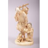 A SUPERB 19TH CENTURY JAPANESE CARVED IVORY OKIMONO of a father with his children, the male figure