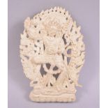 A TIBETAN PLASTER PLAQUE OF A DEITY, 11cm x 8cm.