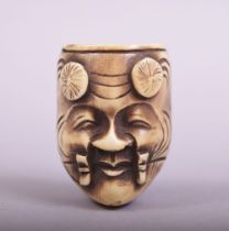 A SMALL JAPANESE CARVED IVORY OR BONE MASK, 3.5cm.
