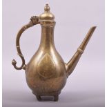 AN 18TH CENTURY MUGHAL BRONZE EWER, with chased decoration, 26cm high.
