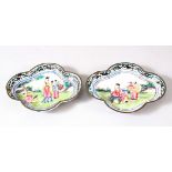 A PAIR OF CHINESE CANTON ENAMELLED DISHES, painted with figures in landscape settings, 9.5cm x 7.