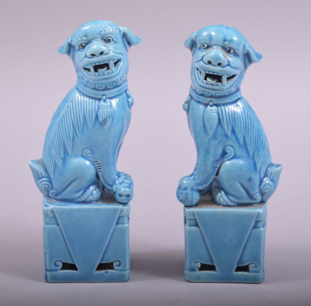 A SMALL PAIR OF CHINESE BLUE GLAZED PORCELAIN KYLIN, 11.5cm high.