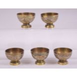 FIVE 19TH CENTURY SYRIAN SILVER AND COPPER OVERLAID PEDESTAL CUPS, diameter 5.5cm.