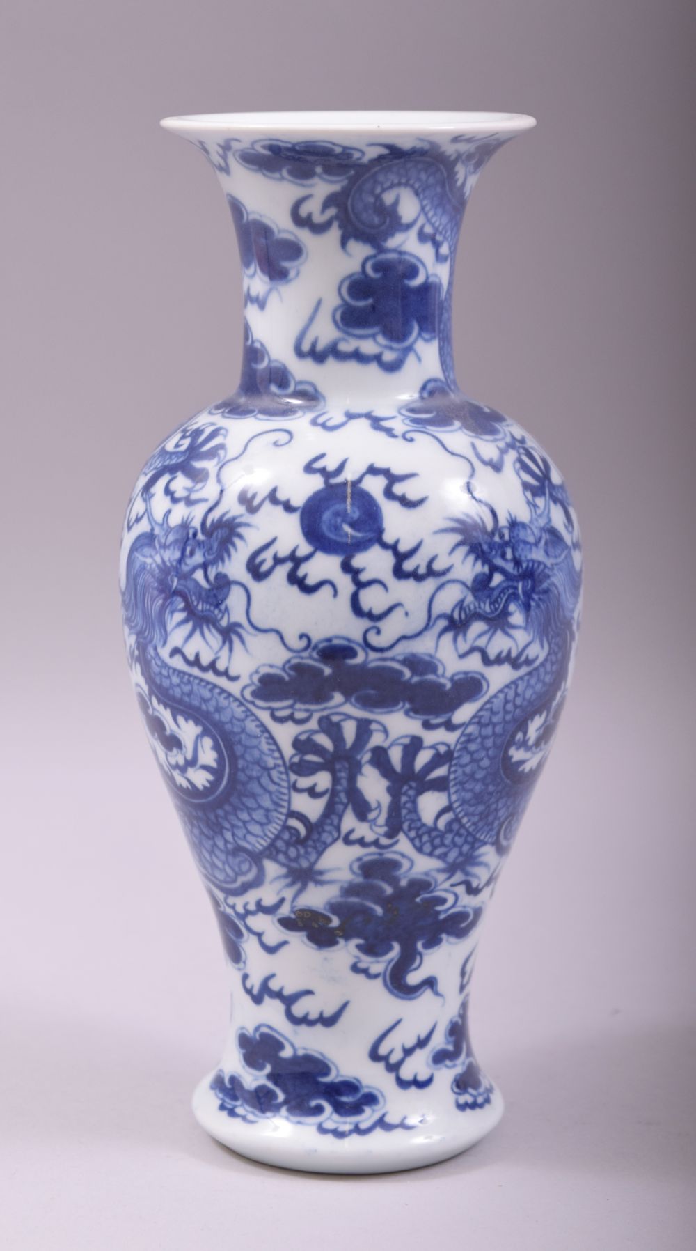 A CHINESE BLUE AND WHITE PORCELAIN DRAGON VASE, 23.5cm high.