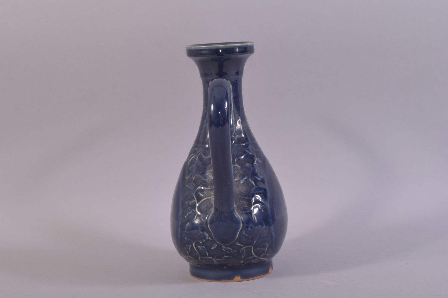 A CHINESE POWDER BLUE GLAZE WINE EWER, decorated with scrolling vines, (af), 24.5cm high. - Image 4 of 6