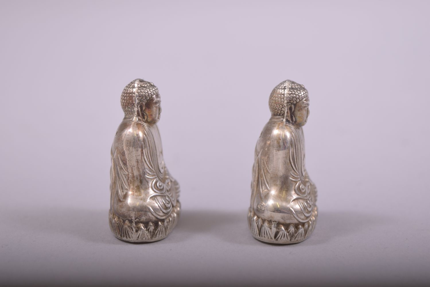 A SMALL PAIR OF SILVER BUDDHA SALT AND PEPPER VESSELS, each stamped 'sterling 950', each 4cm. - Image 4 of 6