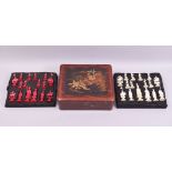 A VERY GOOD 19TH CENTURY CHINESE RED AND WHITE STAINED IVORY CHESS SET, in a fitted lacquer box,