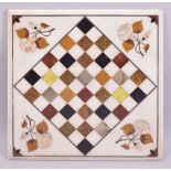 AN ITALIAN SQUARE MARBLE CHESS BOARD, inlaid with specimen marbles with mother of pearl flowers,