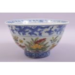 A CHINESE BLUE AND WHITE DOUCAI PORCELAIN BOWL, decorated with ducks and lotus flowers in the doucai