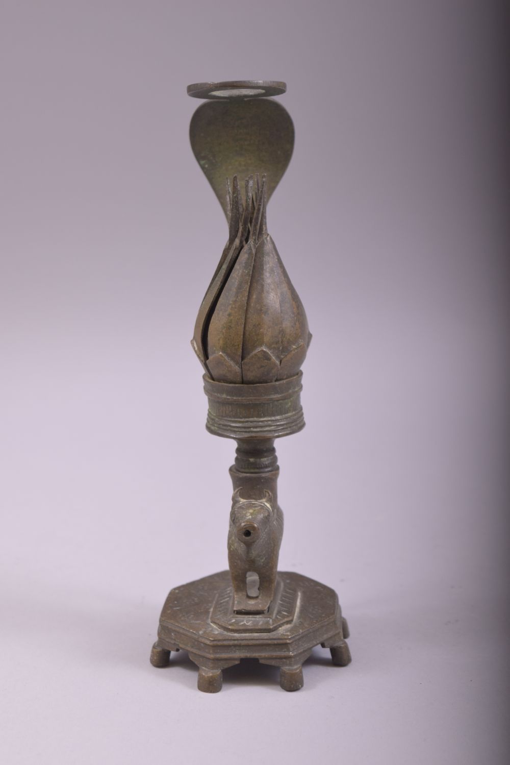 AN UNUSUAL INDIAN BRONZE CANDLESTICK, with reticulated petal formed cup, twisting the petals anti - Image 2 of 5