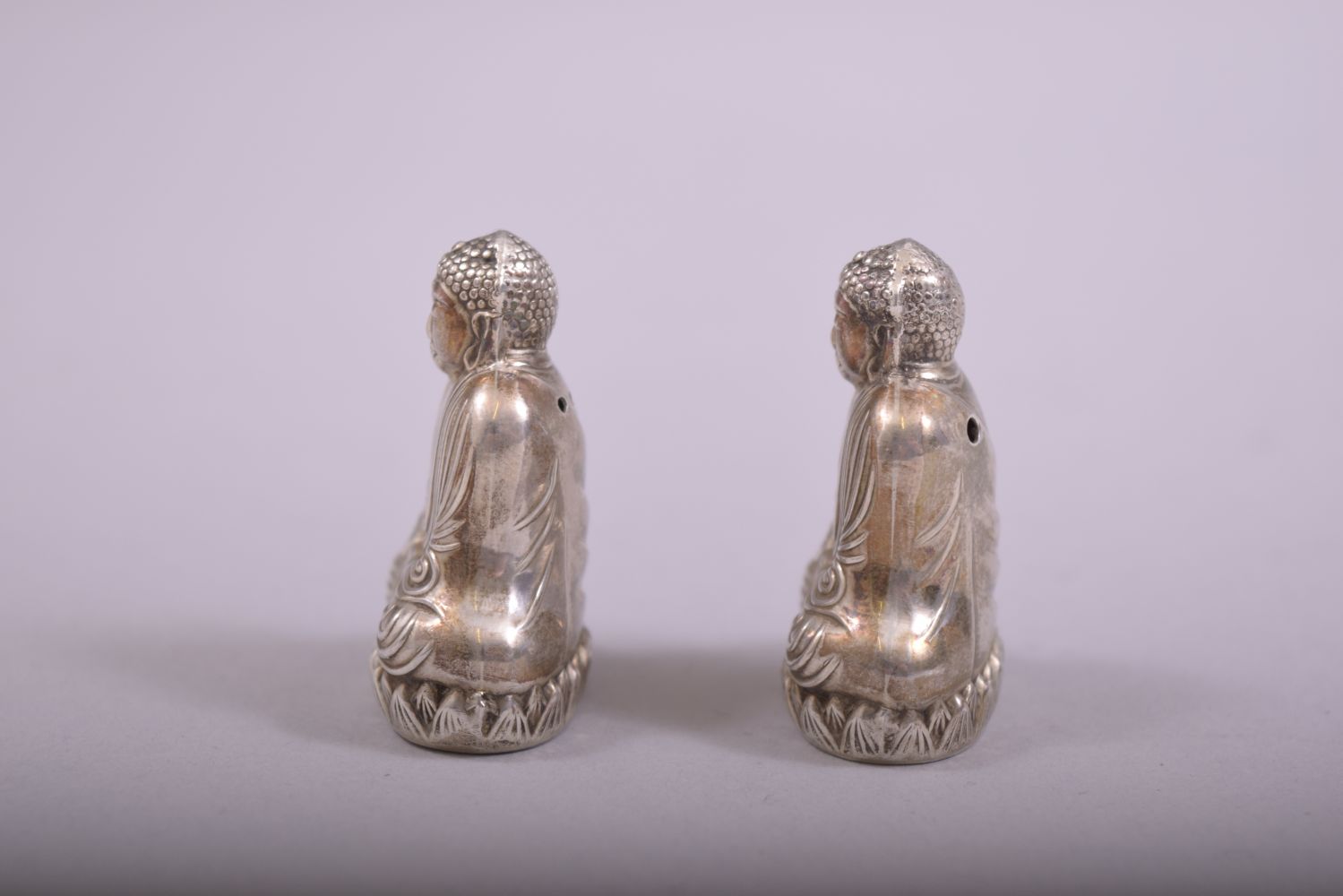 A SMALL PAIR OF SILVER BUDDHA SALT AND PEPPER VESSELS, each stamped 'sterling 950', each 4cm. - Image 2 of 6