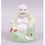 A SMALL PORCELAIN FIGURE OF A SEATED HOTEI, 8cm high.
