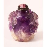 A CHINESE CARVED AMETHYST QUARTZ SNUFF BOTTLE, 5.5cm.