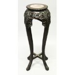 A CHINESE HARDWOOD AND MARBLE INSET CIRCULAR VASE STAND, with pierced and carved frieze and