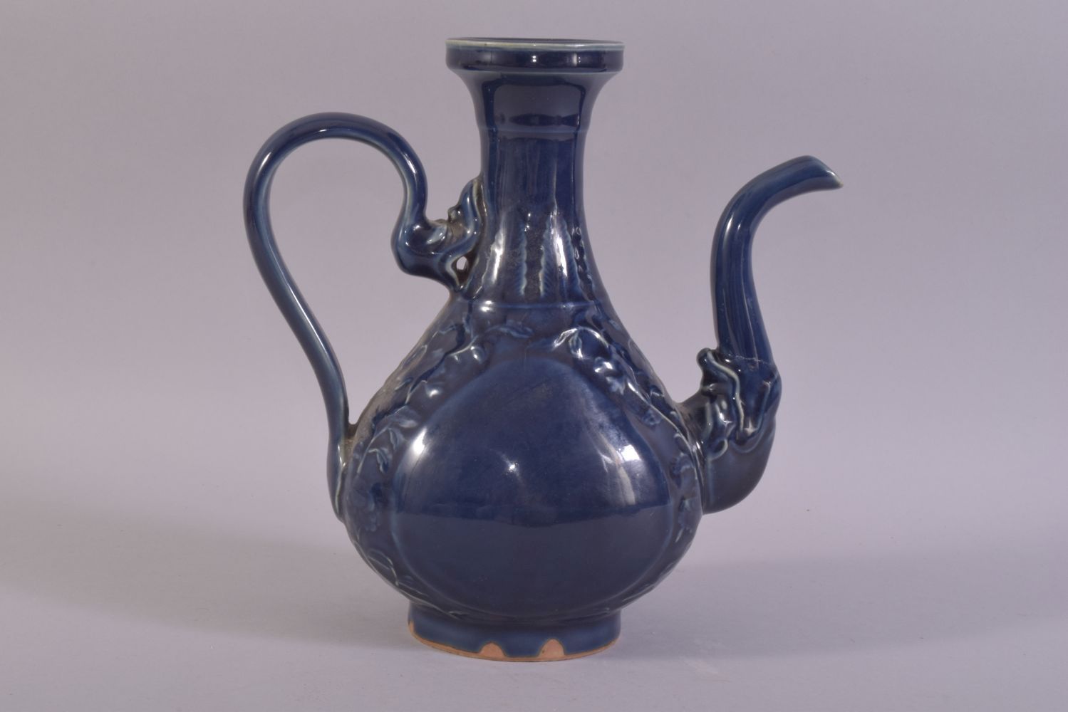 A CHINESE POWDER BLUE GLAZE WINE EWER, decorated with scrolling vines, (af), 24.5cm high. - Image 3 of 6