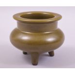 A SMALL CHINESE TEA DUST TRIPOD INCENSE BURNER, impressed mark to base, 7.5cm high.