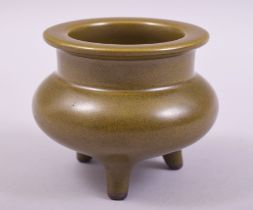 A SMALL CHINESE TEA DUST TRIPOD INCENSE BURNER, impressed mark to base, 7.5cm high.