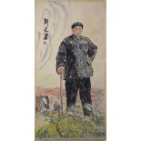 A CHINESE SCROLL PAINTING OF A MALE FIGURE standing in a field, overall 192cm x 78cm.