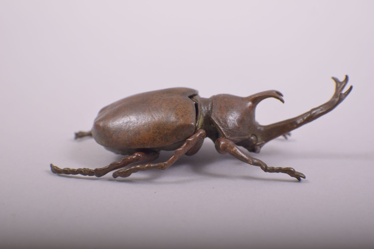 A JAPANESE BRONZE MODEL OF BEETLE; rhinoceros beetle, with an opening hinged back section, 10cm - Image 4 of 7