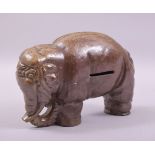 A SALT GLAZED TERRACOTTA ELEPHANT MONEY BOX, 22cm long.